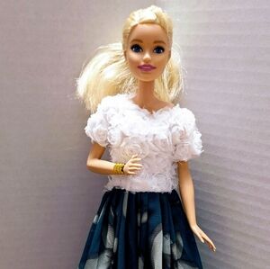 Redressed Barbie Doll with white floral top & green long skirt